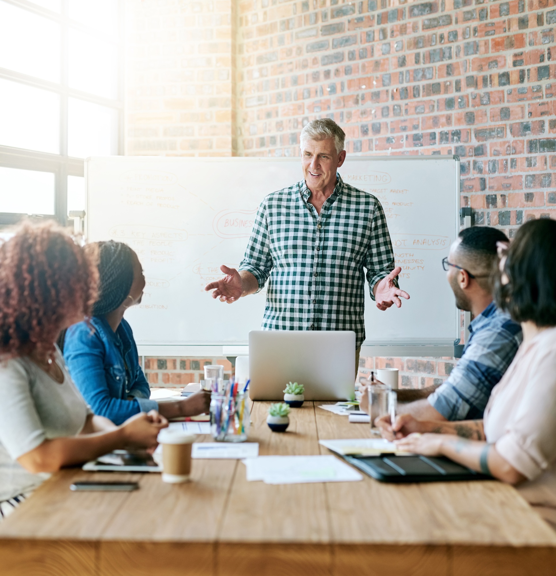 Small business, big vision. Shot of a businessman giving a presentation in the boardroom.